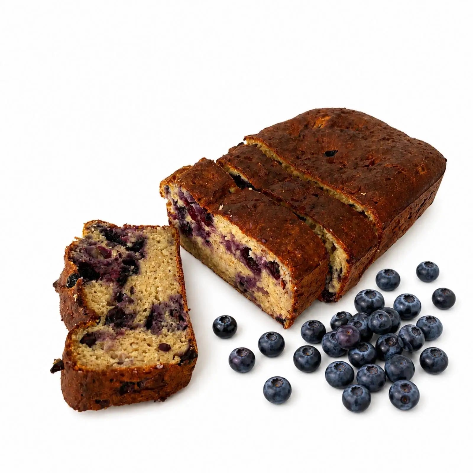 A loaf of blueberry bread with two slices cut and placed beside it, with scattered fresh organic blueberries on a clean white background.