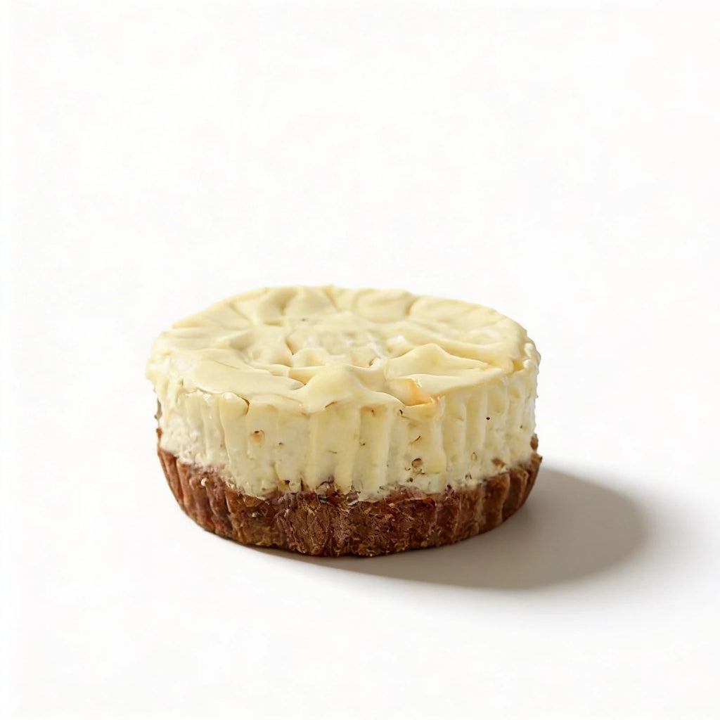 Mini cheesecake with a crumbly base on a white background