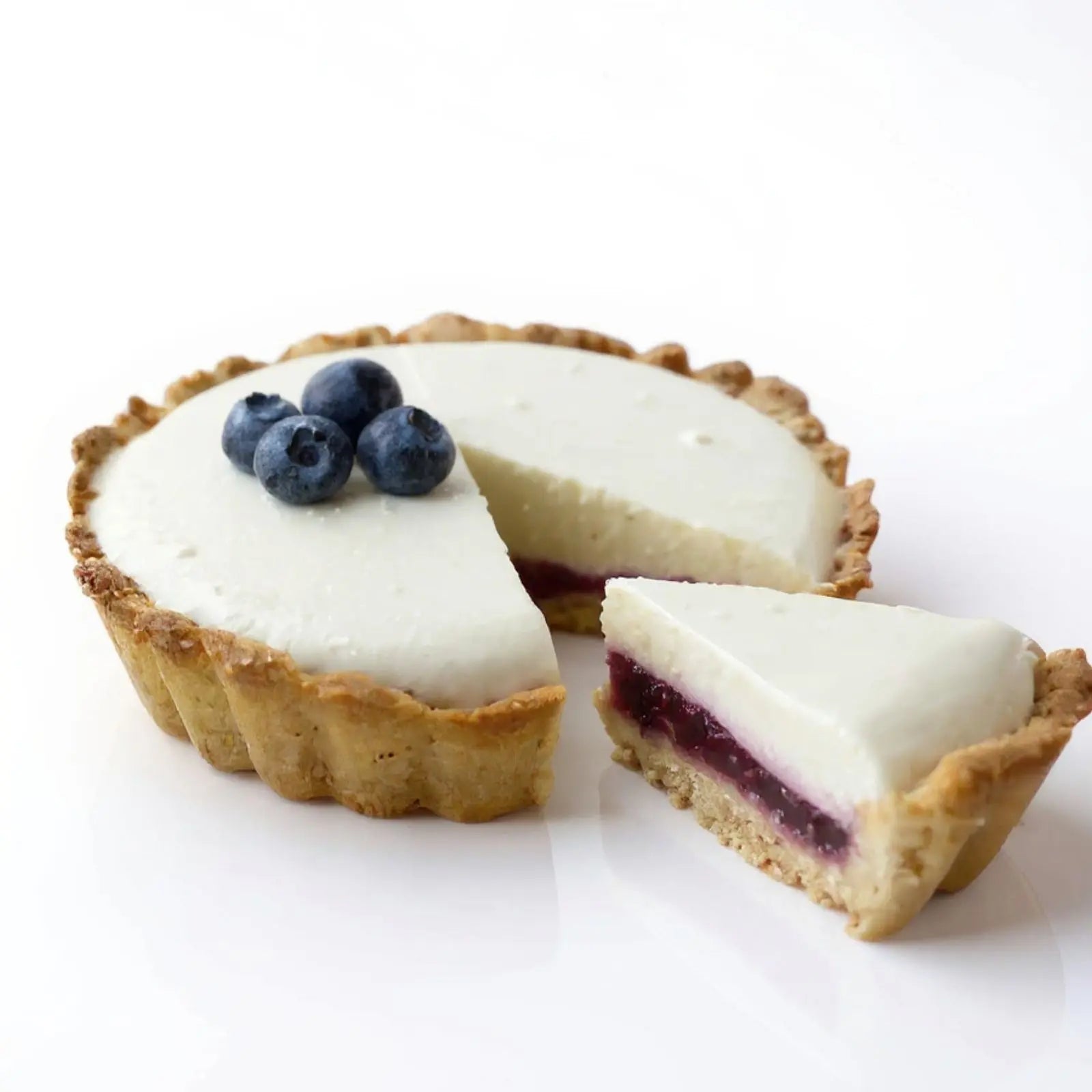 Emberly berry protein cheesecake tart with blueberry topping slice