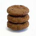 Stack of three brown cookies on a white background