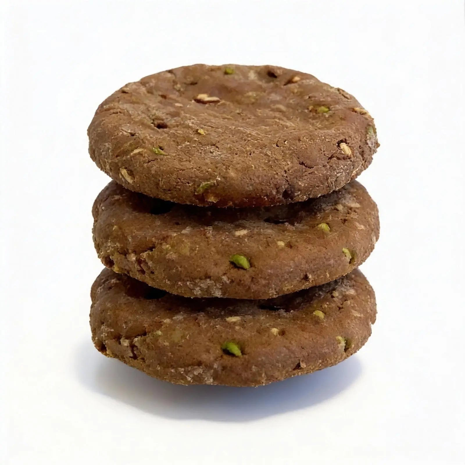 Stack of three brown cookies on a white background