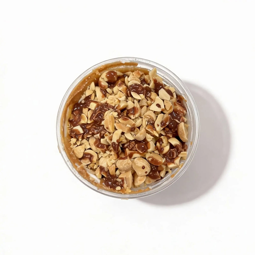 Top view of the chocolate peanut protein oatmeal and nuts on a white background