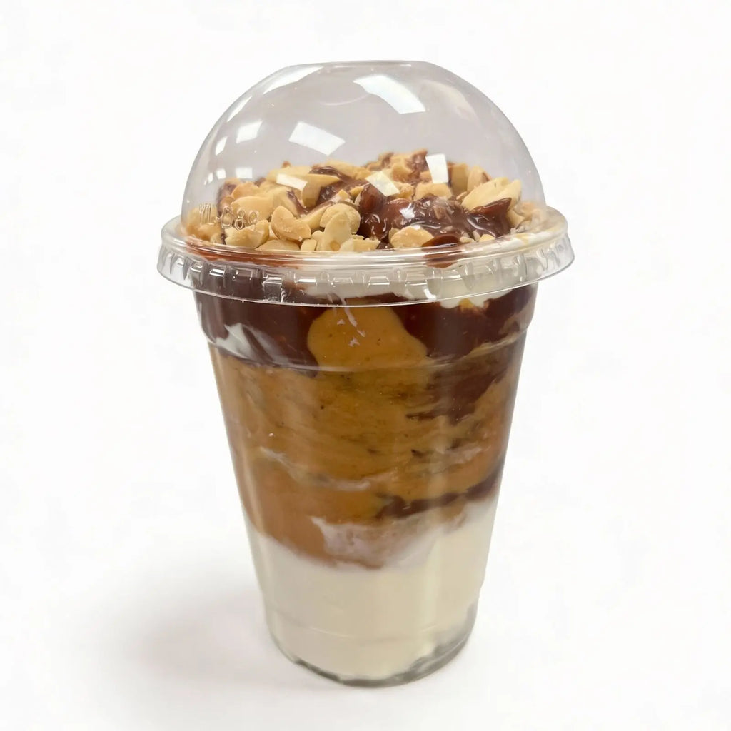 Chocolate peanut protein oatmeal with nuts on a white background