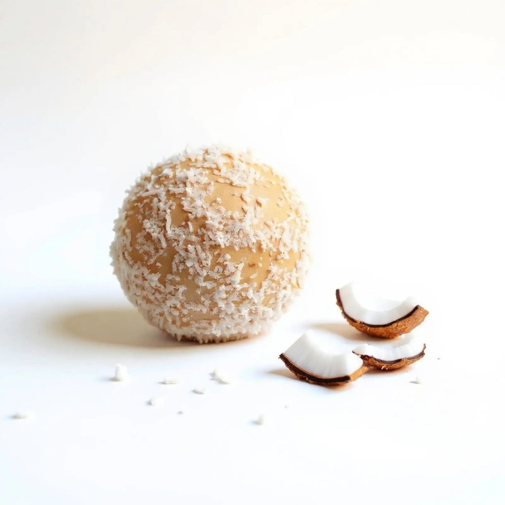 Emberly coconut protein ball with shredded coconut
