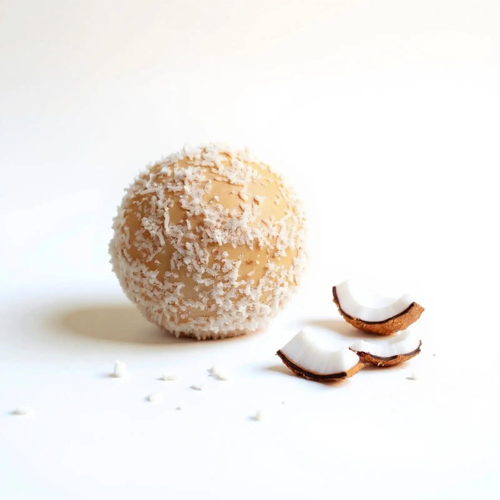 Emberly coconut protein ball with shredded coconut